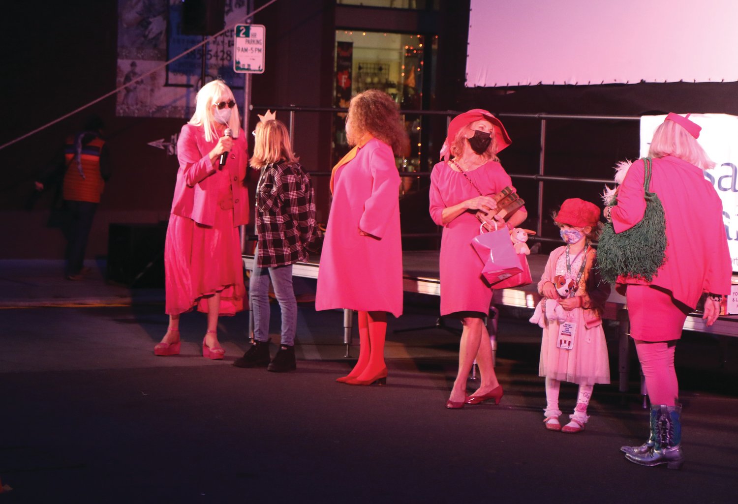 Contestants for the “Look like Elle and Bruiser” contest lined up on Saturday evening in the hottest of pink hues. Kirsten “Kiwi” Smith, the screenwriter of “Legally Blonde,” pictured third from the left, was on site to judge the contest. Smith celebrated the 20th anniversary of the film with the audience afterward at the 2021 Port Townsend Film Fest’s second outdoor feature night.
